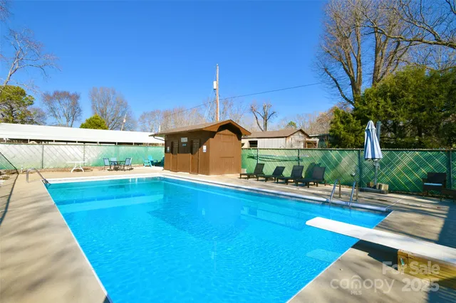 a view of a swimming pool with an outdoor seating