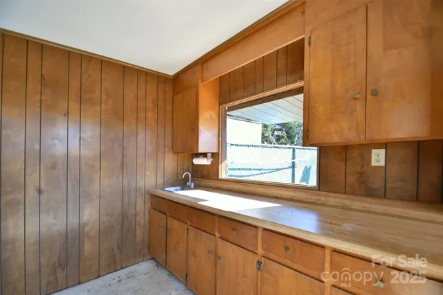 a bathroom with a sink and a large mirror