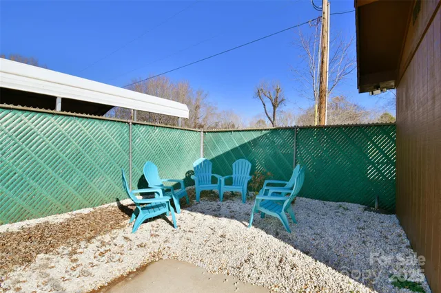 a view of a two chairs in patio