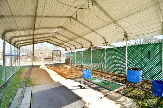 a view of a backyard with sitting area