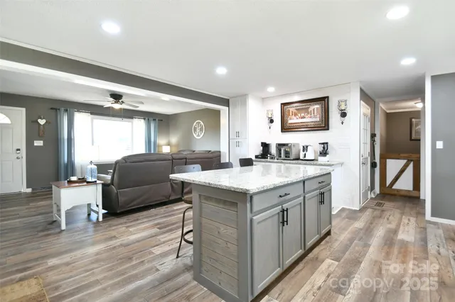 a kitchen with a stove a refrigerator and a sink