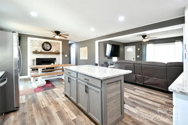 a kitchen with a sink and a stove top oven