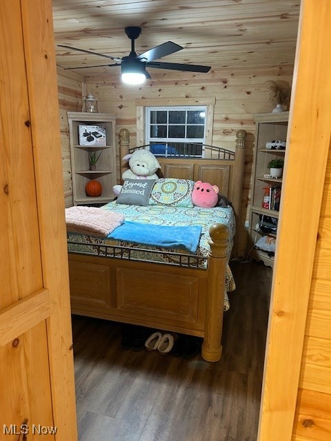 2445 McCord Hill Road Wellsburg, WV 26070 - Photo 9 of 37 Bedroom with wooden walls, wood finished floors, a ceiling fan, and wood ceiling