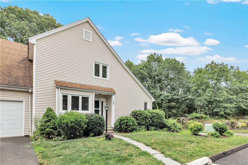 161 Pheasant Ridge, Unit 161 Shelton, CT 06484 - Photo 1 of 1 a view of a house with yard and plants