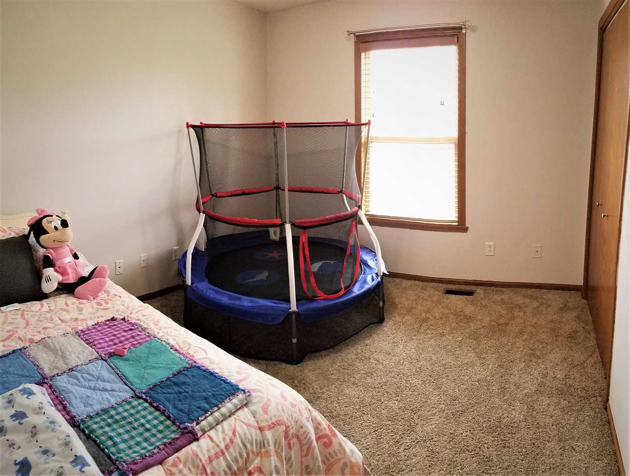 1760 South Weldon Road Rockford, IL 61102 - Photo 11 of 22 a bedroom with a bed and window