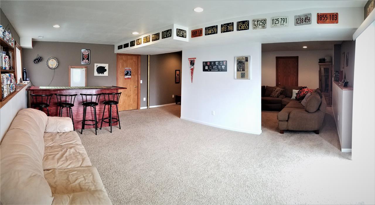 1760 South Weldon Road Rockford, IL 61102 - Photo 14 of 22 a living room with furniture and a flat screen tv