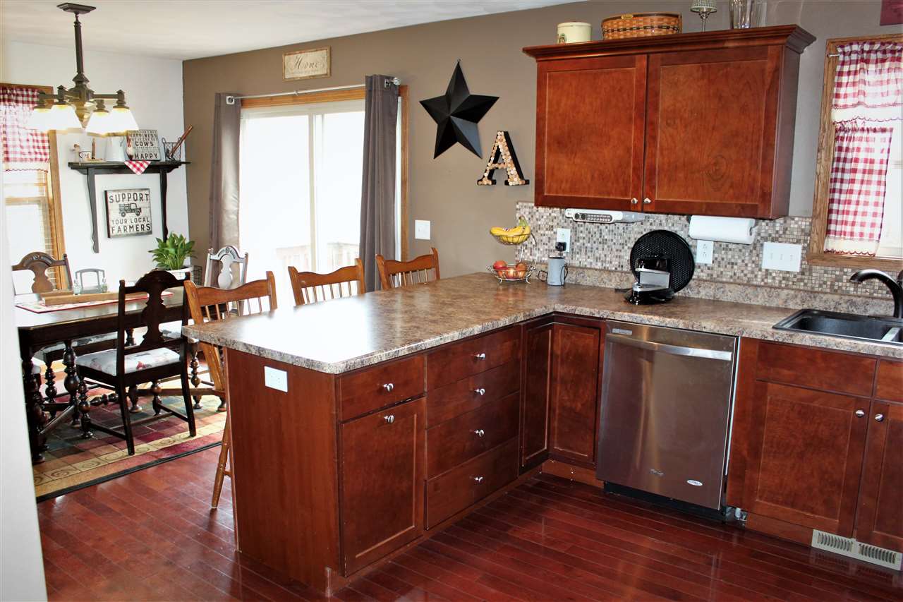 1760 South Weldon Road Rockford, IL 61102 - Photo 6 of 22 a kitchen with a sink cabinets and window