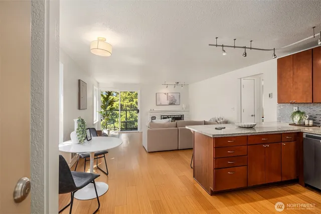 a kitchen with a cabinets and chairs in it