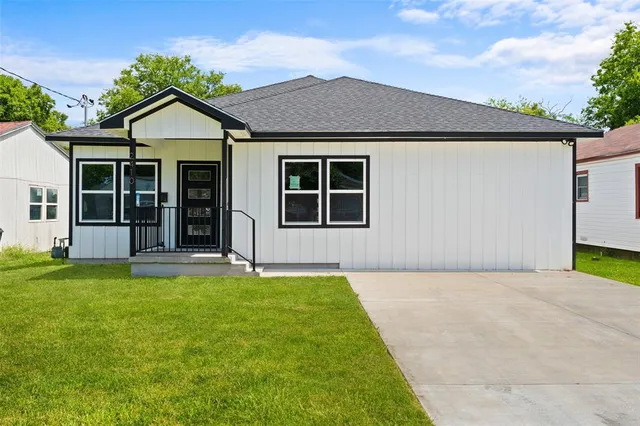 a house with garden in front of it