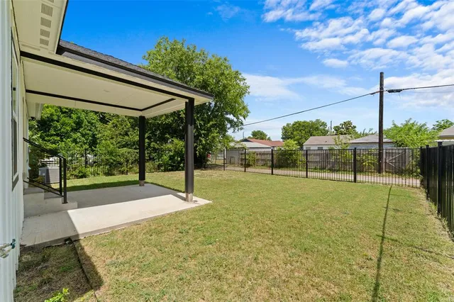 a view of a backyard with swimming pool