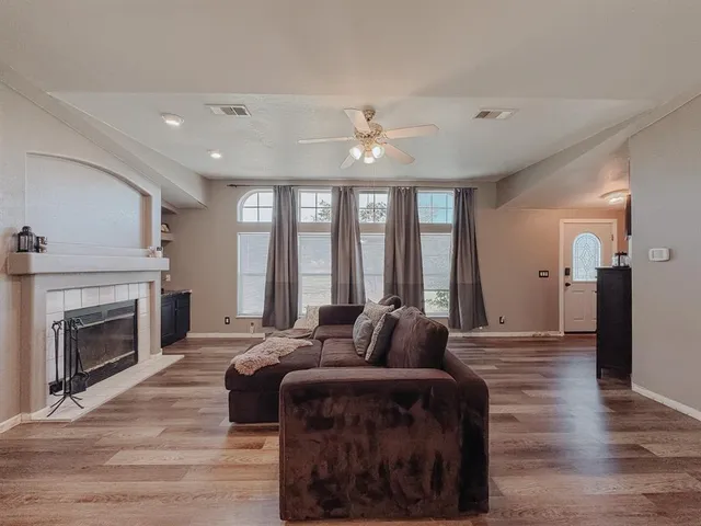 a large bedroom with a bed and a fireplace