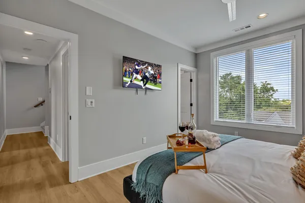 a bedroom with a bed and a window