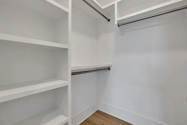 a view of an empty walk in closet