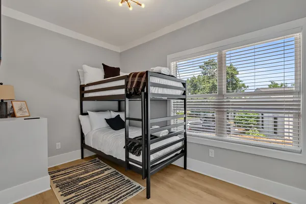 a bedroom with furniture and a window
