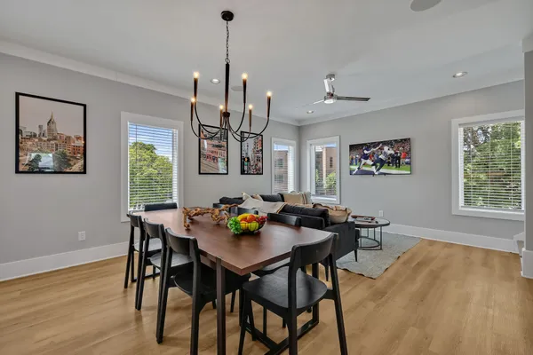 a view of a dining room with furniture window and wooden floor