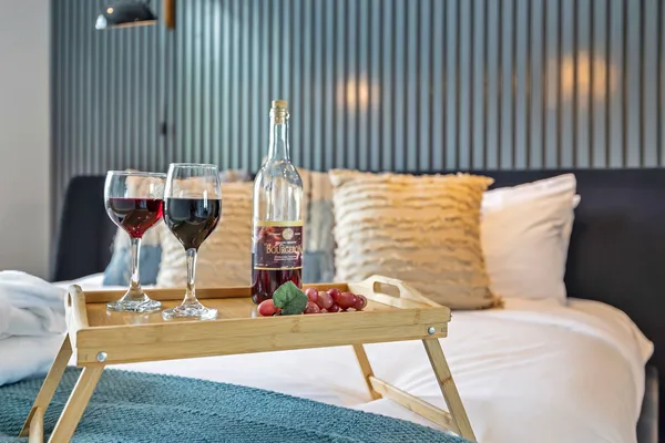 a bed room with a bed and a night stand