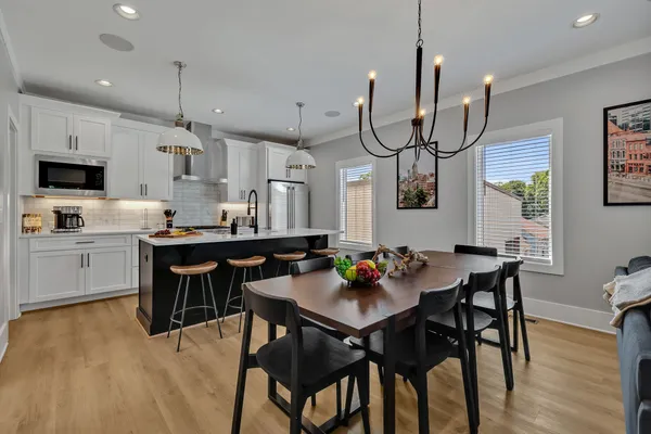 a roof deck with a table and chairs
