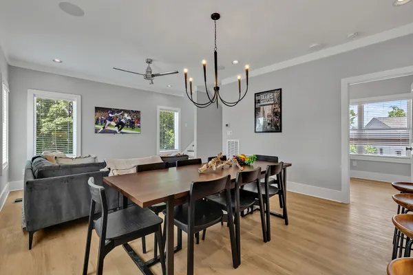a view of a dining room with furniture window and wooden floor