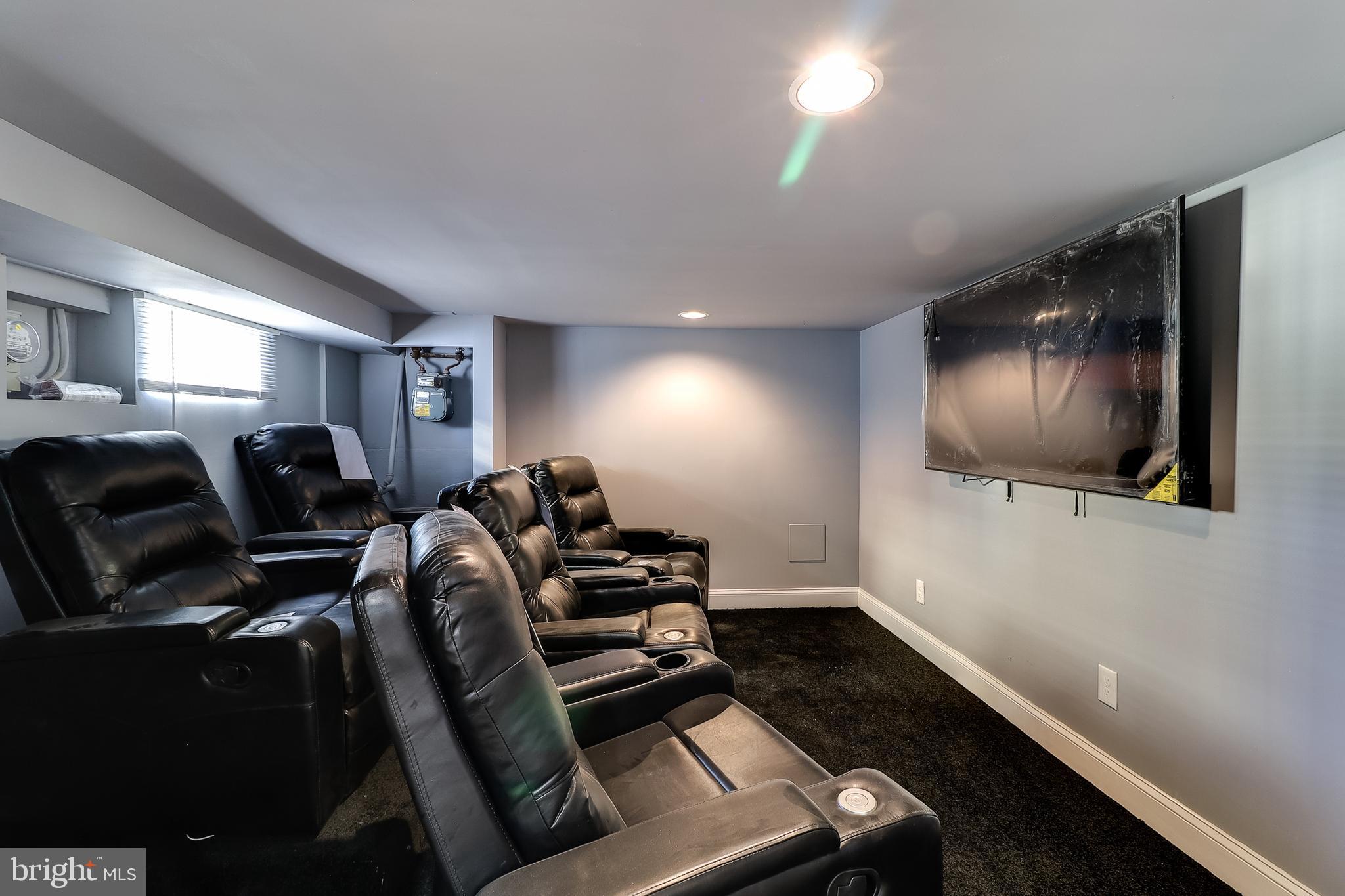 322 Townsend Road Baltimore, MD 21221 - Photo 3 of 37 Theater Room-5- Chairs and 65" Flat Screen TV