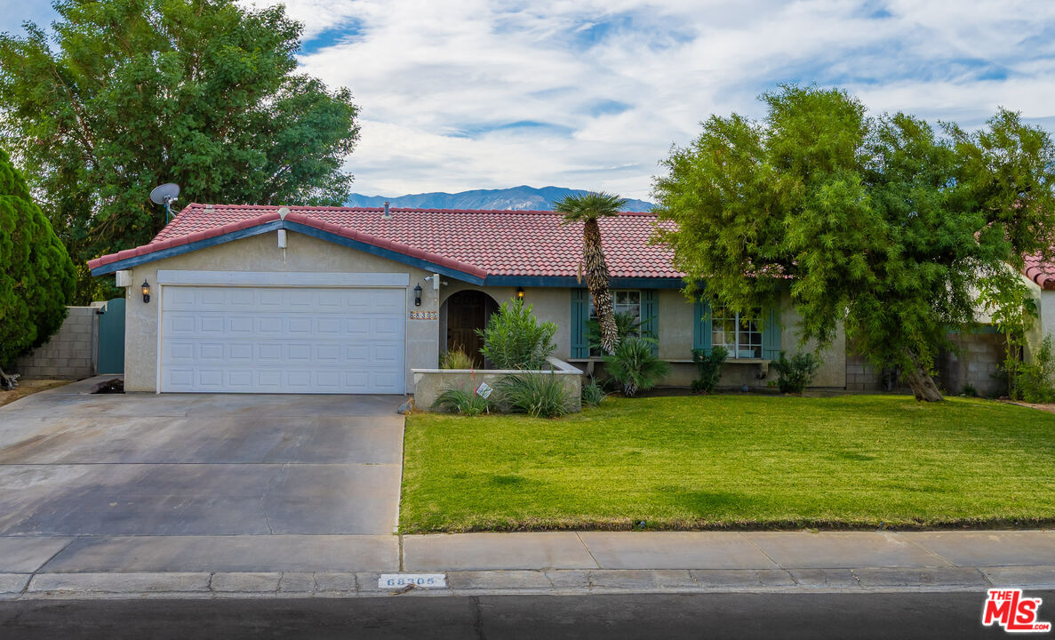 68305 Encinitas Road Cathedral City, CA 92234 - Photo 1 of 33 a front view of a house with garden