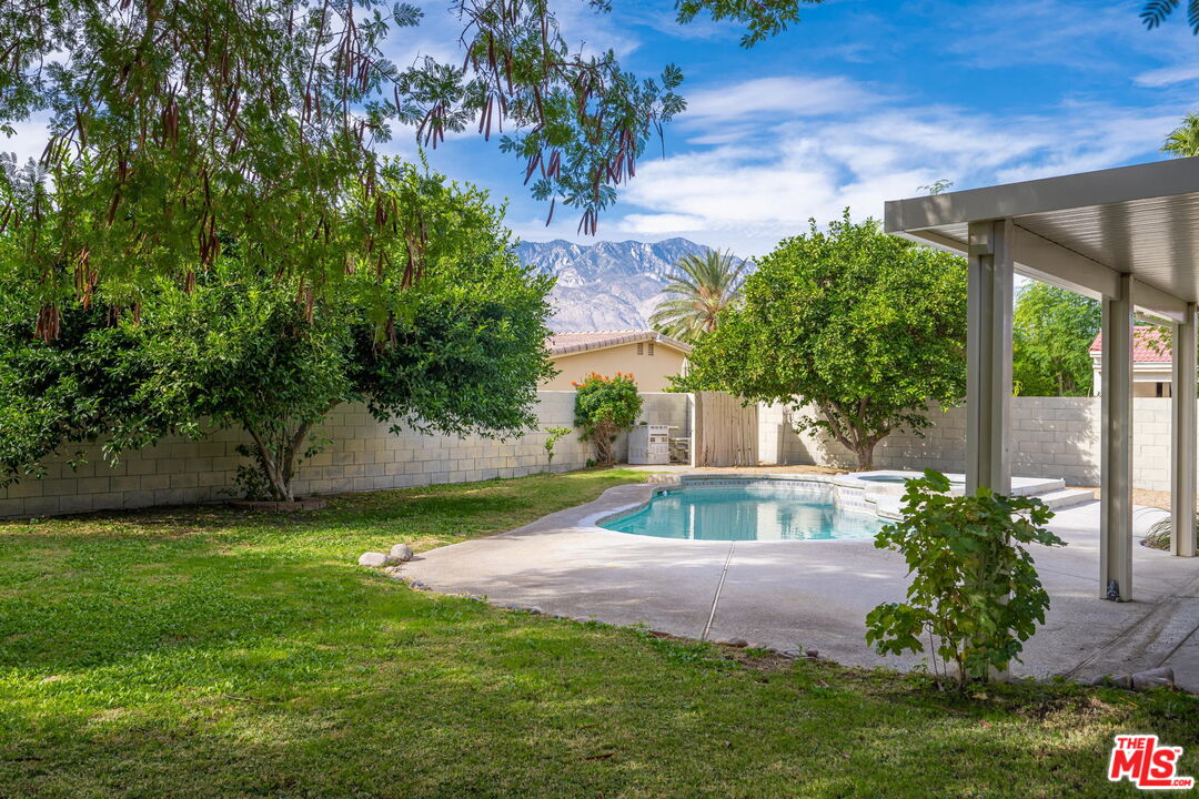 68305 Encinitas Road Cathedral City, CA 92234 - Photo 14 of 33 a view of a backyard with a garden
