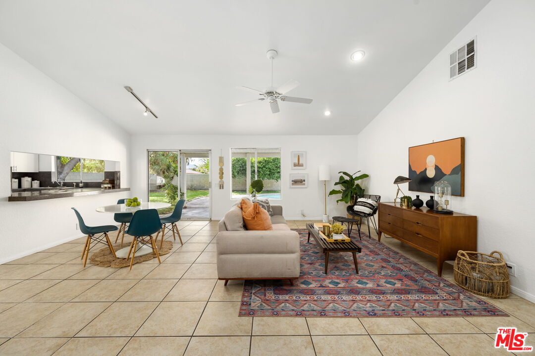 68305 Encinitas Road Cathedral City, CA 92234 - Photo 6 of 33 a living room with furniture and a flat screen tv