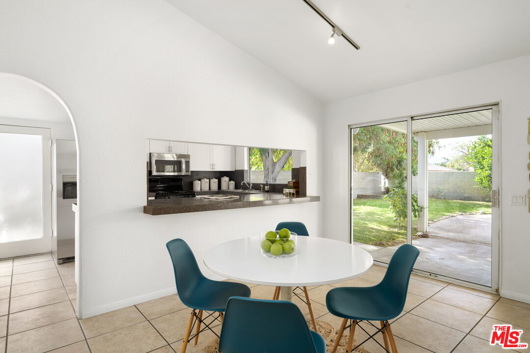 68305 Encinitas Road Cathedral City, CA 92234 - Photo 10 of 33 a view of a dining room with furniture window and outside view