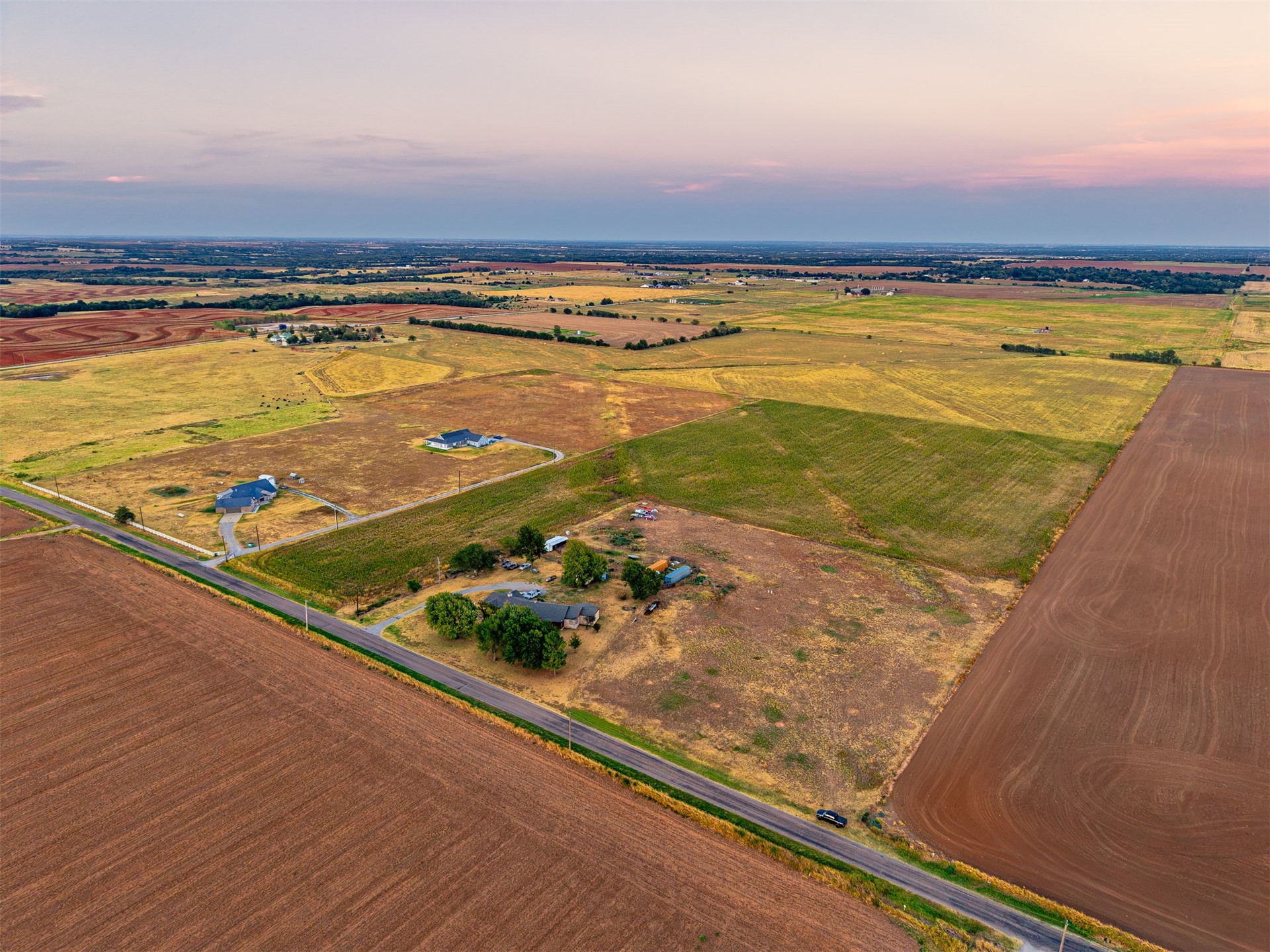 16 North Gregory Road Yukon, OK 73099 - Photo 16 of 34 Expansive land parcel featuring open fields and distant structures