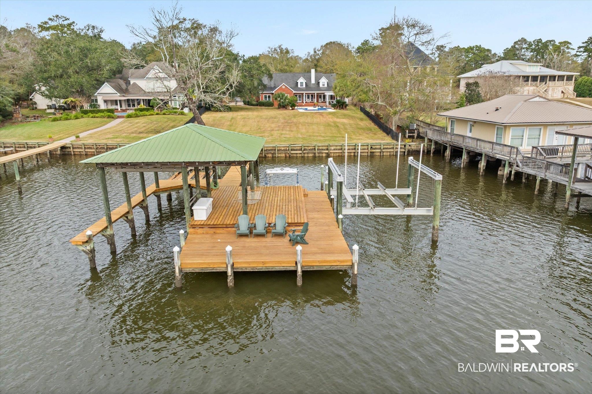 4851 Audubon Drive Mobile, AL 36619 - Photo 30 of 46 Dock with boat lift, a water view, and a residential view
