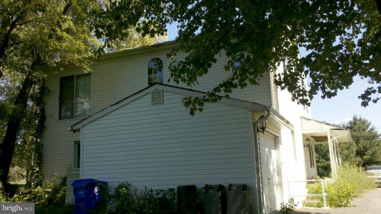21022 Clarksburg Road Boyds, MD 20841 - Photo 2 of 8 a view of a small house with a tree