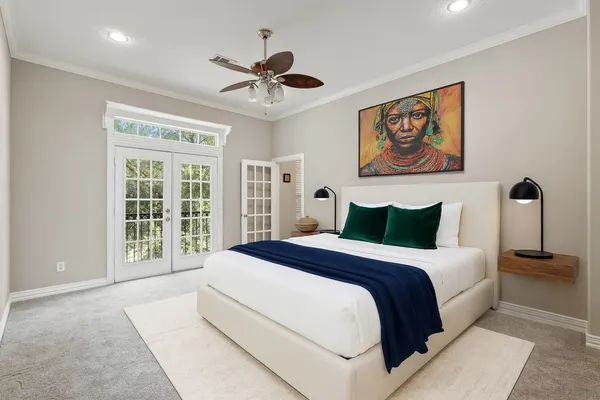 a spacious bedroom with a large bed and a window