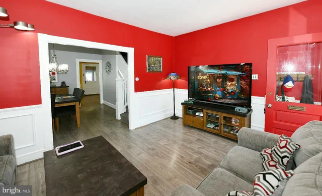 a living room with furniture and a flat screen tv