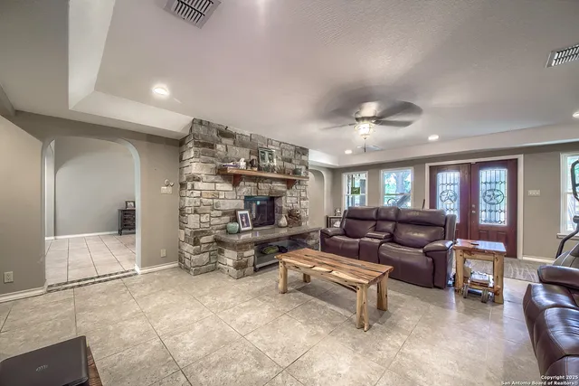 a living room with furniture and a large window