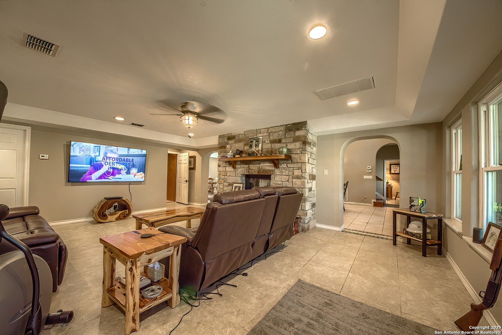 5464 Coughran Road Pleasanton, TX 78064 - Photo 16 of 55 a large living room with stainless steel appliances furniture a rug and a large window