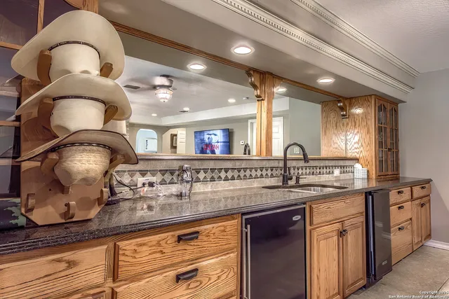 a kitchen with a sink and a stove