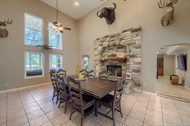 a view of a dining room with furniture and chandelier