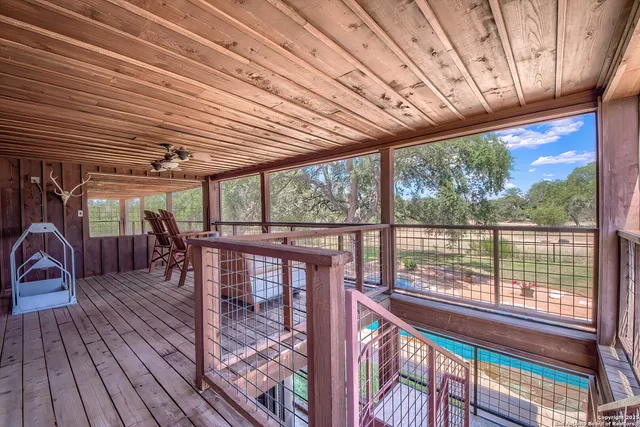a view of a patio with wooden floor