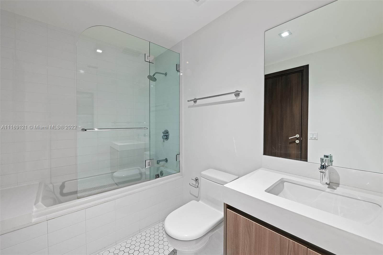401 North Birch Road, Unit TH7 Fort Lauderdale, FL 33304 - Photo 16 of 29 a bathroom with a sink toilet and shower