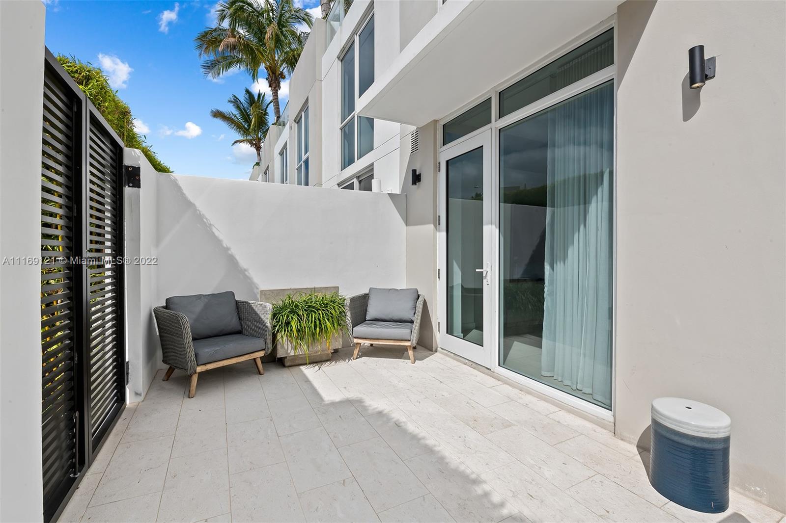 401 North Birch Road, Unit TH7 Fort Lauderdale, FL 33304 - Photo 19 of 29 a balcony with potted plants and a potted plant
