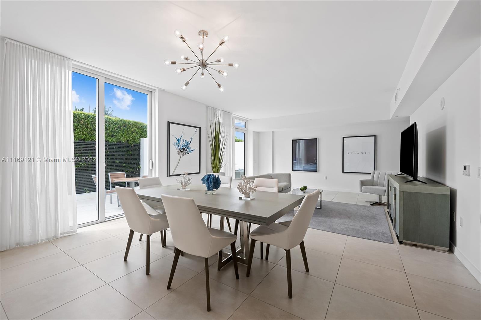401 North Birch Road, Unit TH7 Fort Lauderdale, FL 33304 - Photo 4 of 29 a view of a dining room with furniture and window