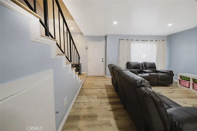 a living room with furniture and a rug