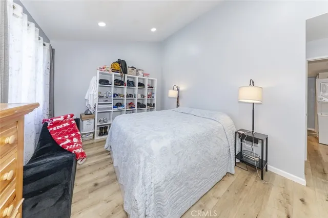 a bed room with a bed and a chair