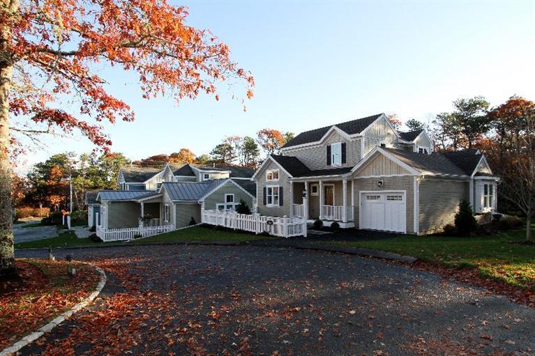 14 Cross Road Mashpee, MA 02649 - Photo 1 of 35 a view of a house with a big yard and large trees