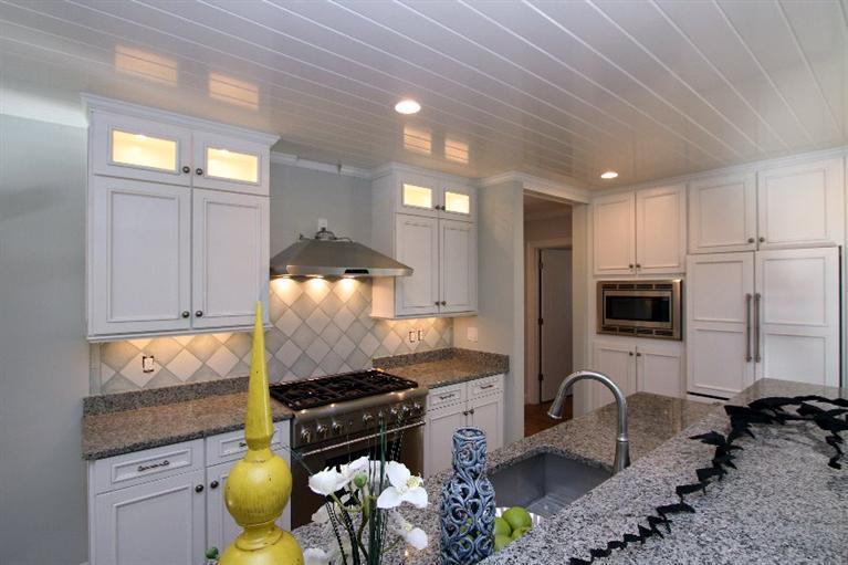 14 Cross Road Mashpee, MA 02649 - Photo 15 of 35 a kitchen with granite countertop a stove a sink and a refrigerator