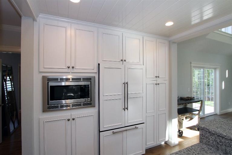 14 Cross Road Mashpee, MA 02649 - Photo 17 of 35 a kitchen with white cabinets and white appliances
