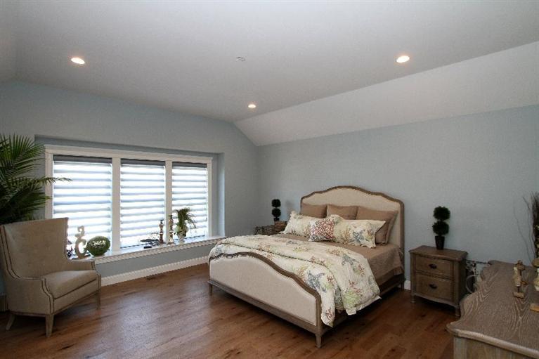 14 Cross Road Mashpee, MA 02649 - Photo 20 of 35 a bedroom with a bed and a couch with wooden floor
