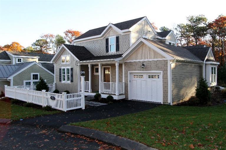 14 Cross Road Mashpee, MA 02649 - Photo 2 of 35 a front view of a house with garden