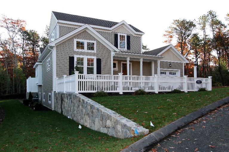 14 Cross Road Mashpee, MA 02649 - Photo 3 of 35 a front view of a house with a yard