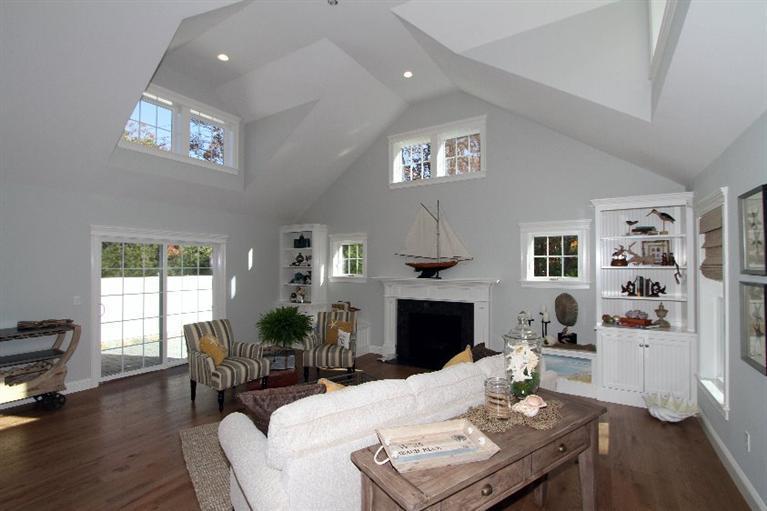 14 Cross Road Mashpee, MA 02649 - Photo 8 of 35 a living room with furniture and a fireplace