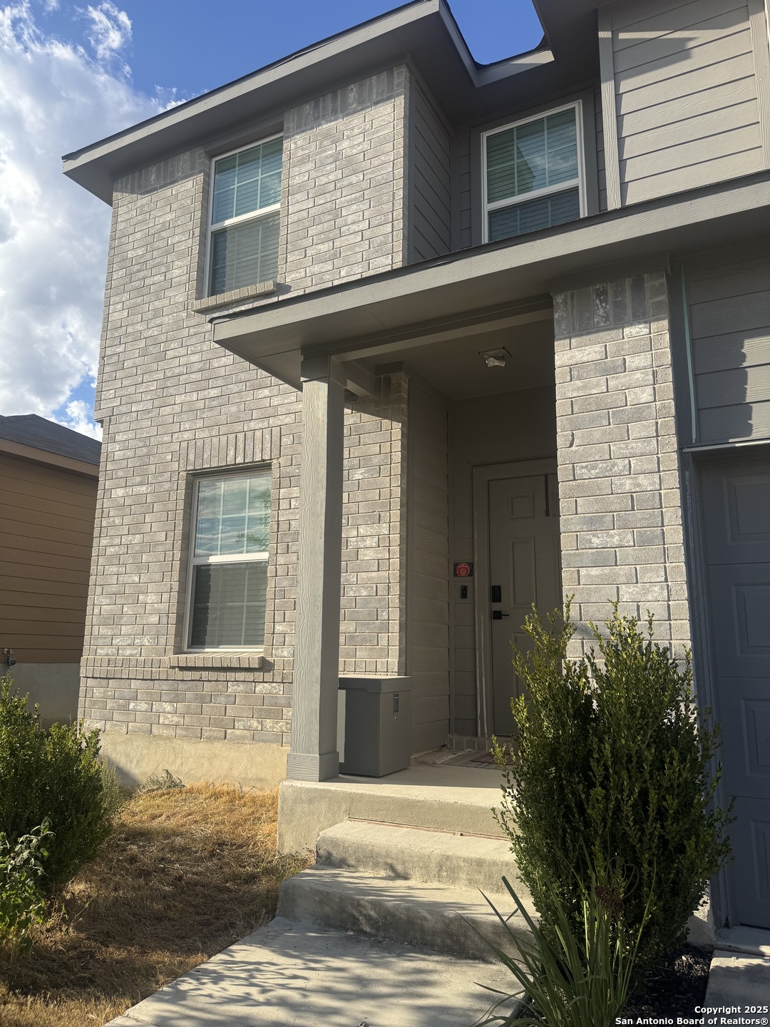 a front view of a house with a yard